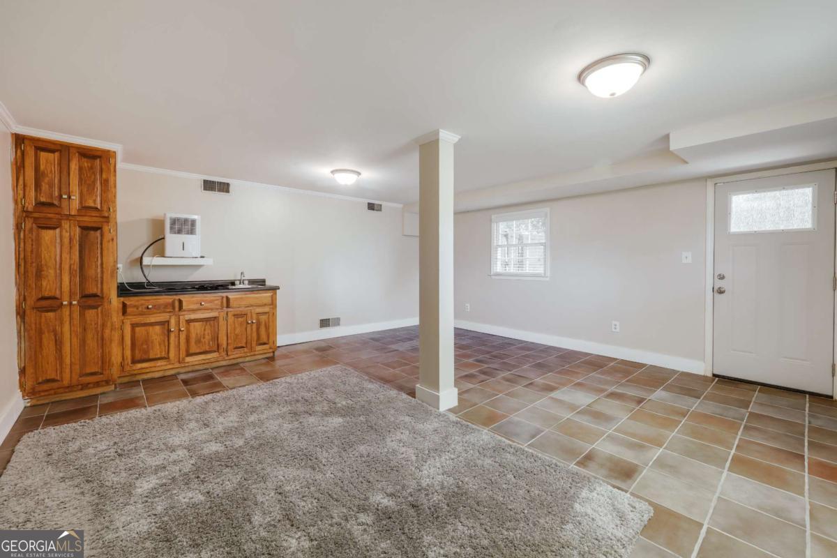 206 Fortson Drive Athens, GA 30606 - Photo 31 of 38 a view of a kitchen with furniture and an empty room