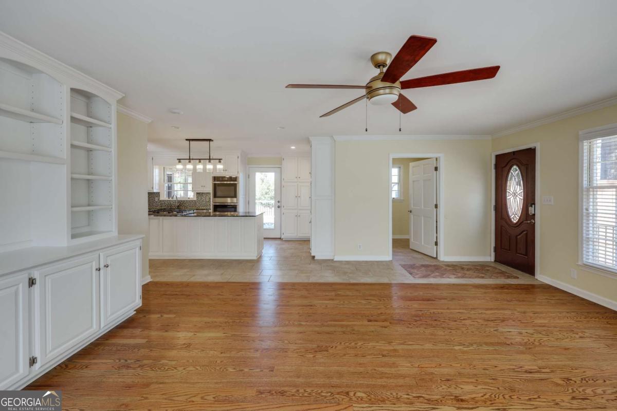 206 Fortson Drive Athens, GA 30606 - Photo 5 of 38 a view of empty room with wooden floor and window
