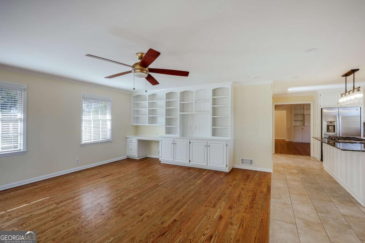 206 Fortson Drive Athens, GA 30606 - Photo 10 of 38 a view of empty room with wooden floor and fan