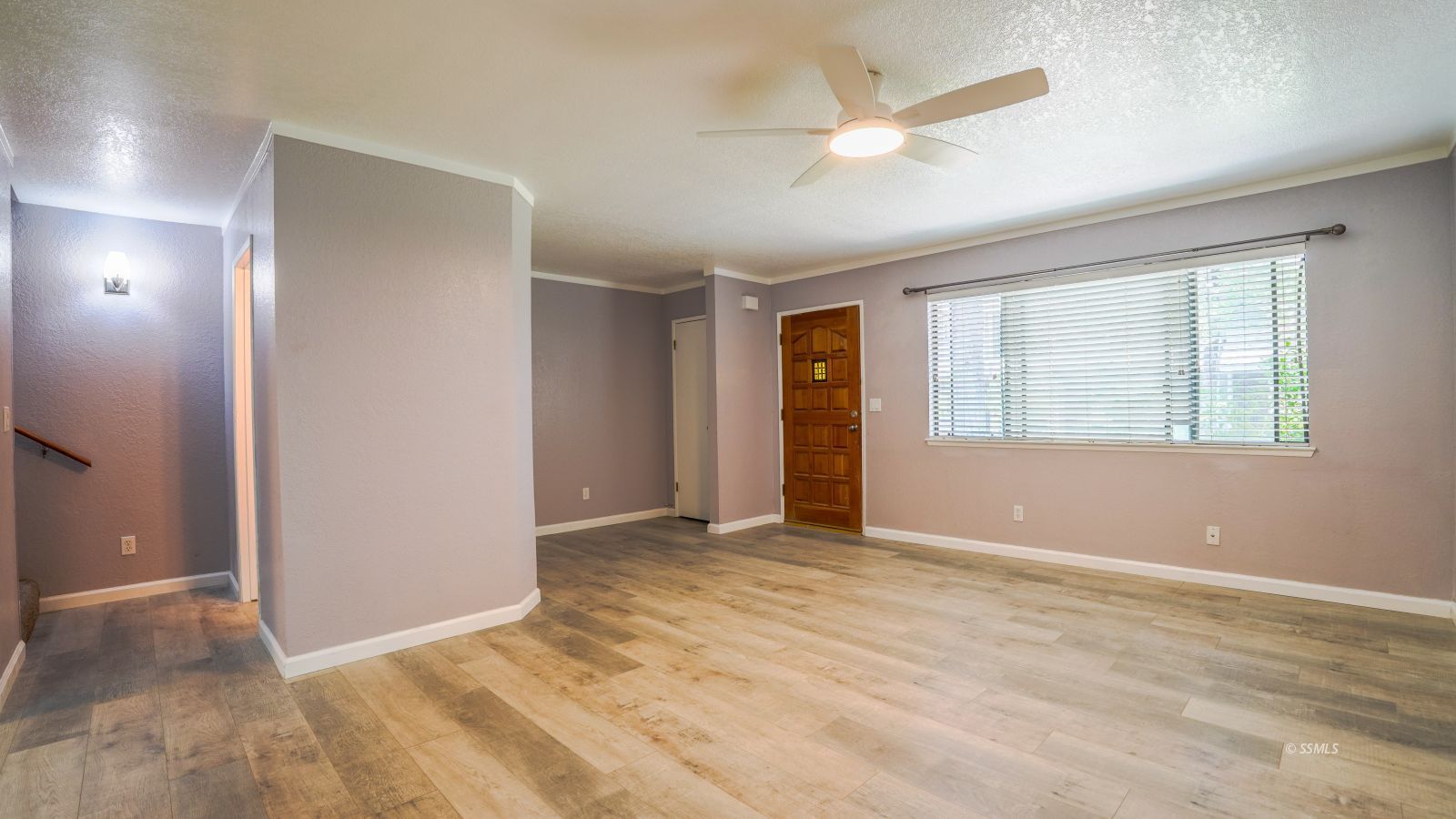 293 East Upjohn Avenue Ridgecrest, CA 93555 - Photo 4 of 21 a view of an empty room with window and a ceiling fan