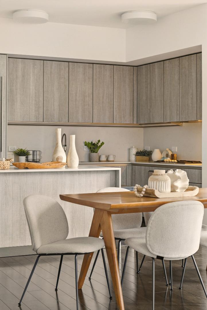 318 Main Street, Unit 6B San Francisco, CA 94105 - Photo 12 of 40 a kitchen with a table chairs and a refrigerator