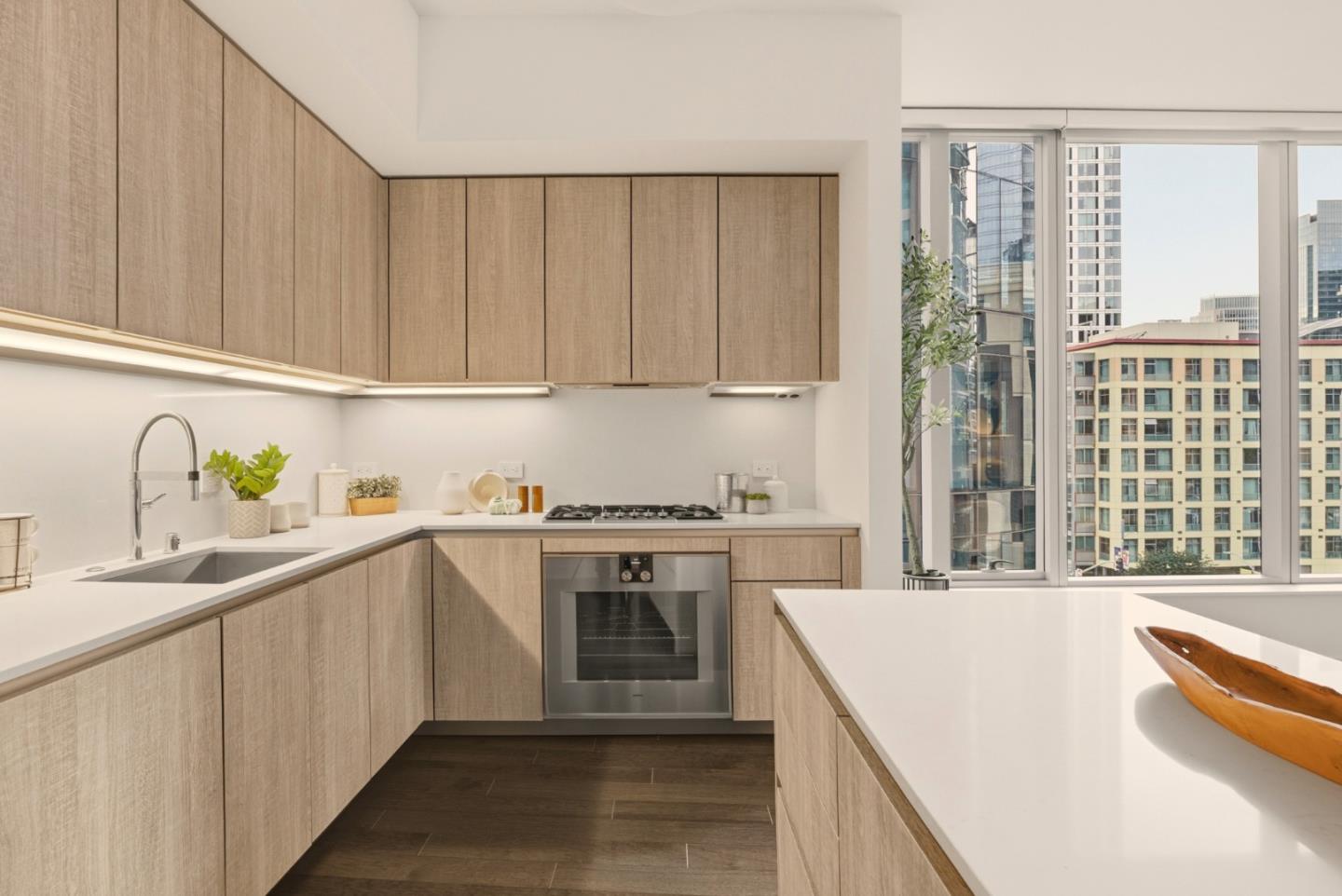 318 Main Street, Unit 6B San Francisco, CA 94105 - Photo 14 of 40 a kitchen with stainless steel appliances granite countertop a sink and a stove