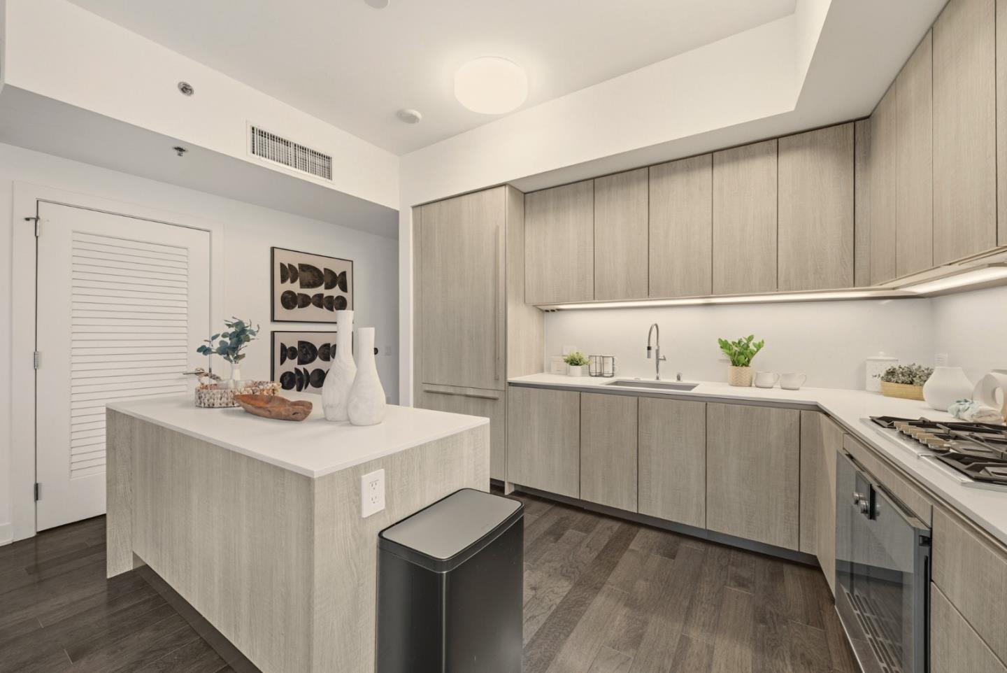 318 Main Street, Unit 6B San Francisco, CA 94105 - Photo 15 of 40 a kitchen with a sink cabinets and wooden floor