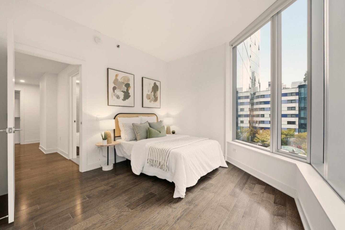 318 Main Street, Unit 6B San Francisco, CA 94105 - Photo 25 of 40 a bedroom with a large bed and a large window