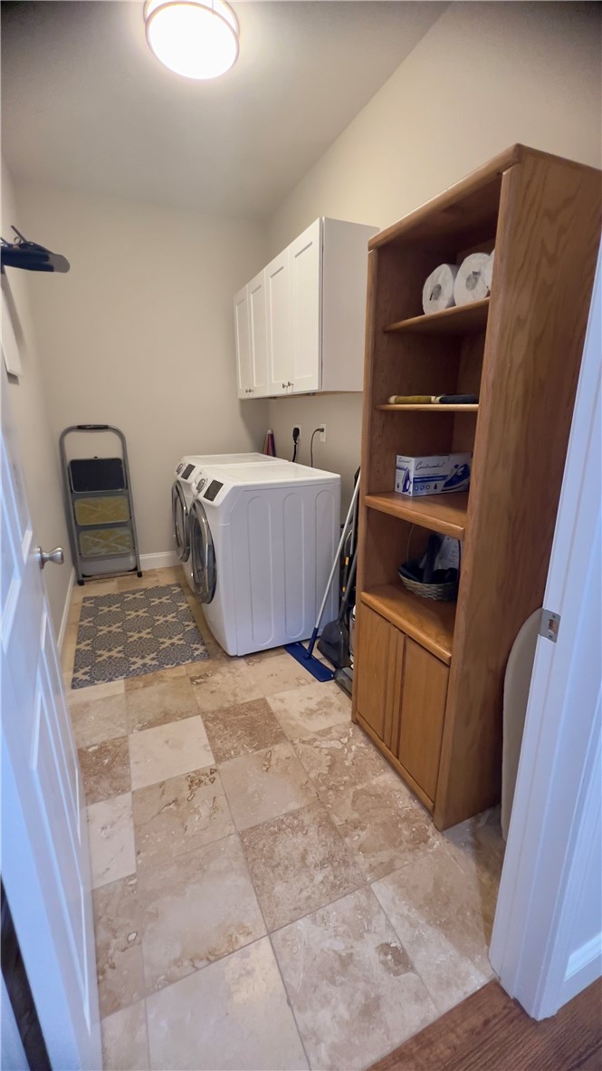 160 Hudgins Lake Road Townville, SC 29689 - Photo 15 of 41 Functional laundry space featuring durable tile flooring and convenient upper cabinetry.