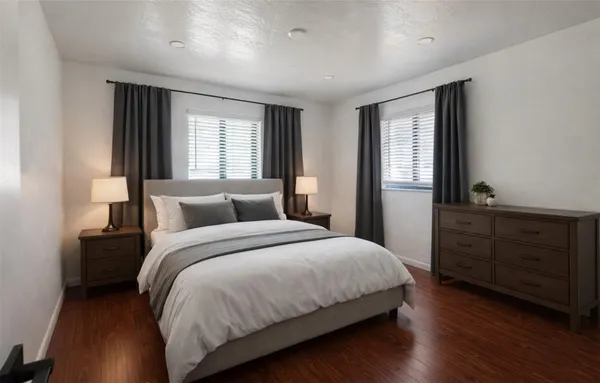 a bedroom with a bed and a dresser