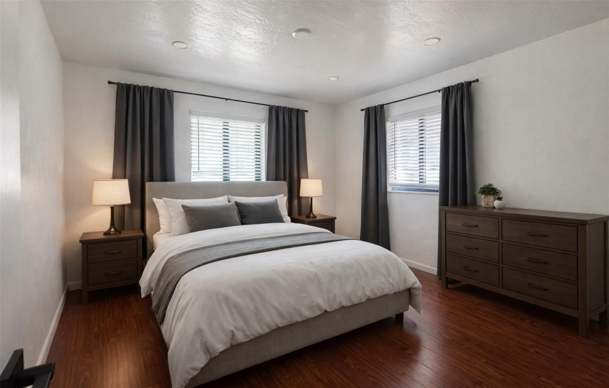 a bedroom with a bed and a dresser