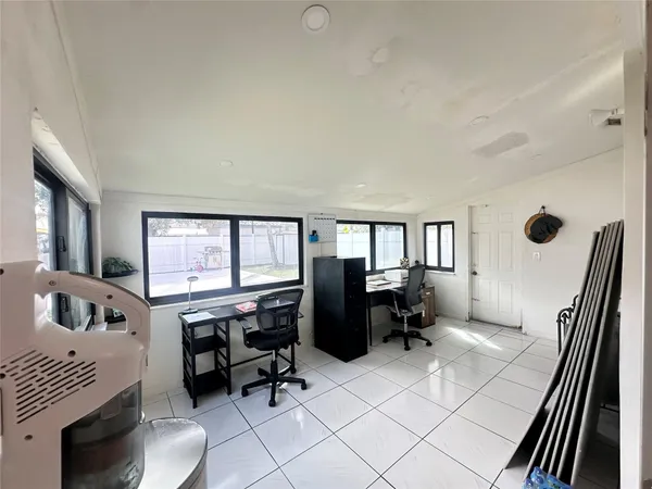 a workspace with furniture and a window