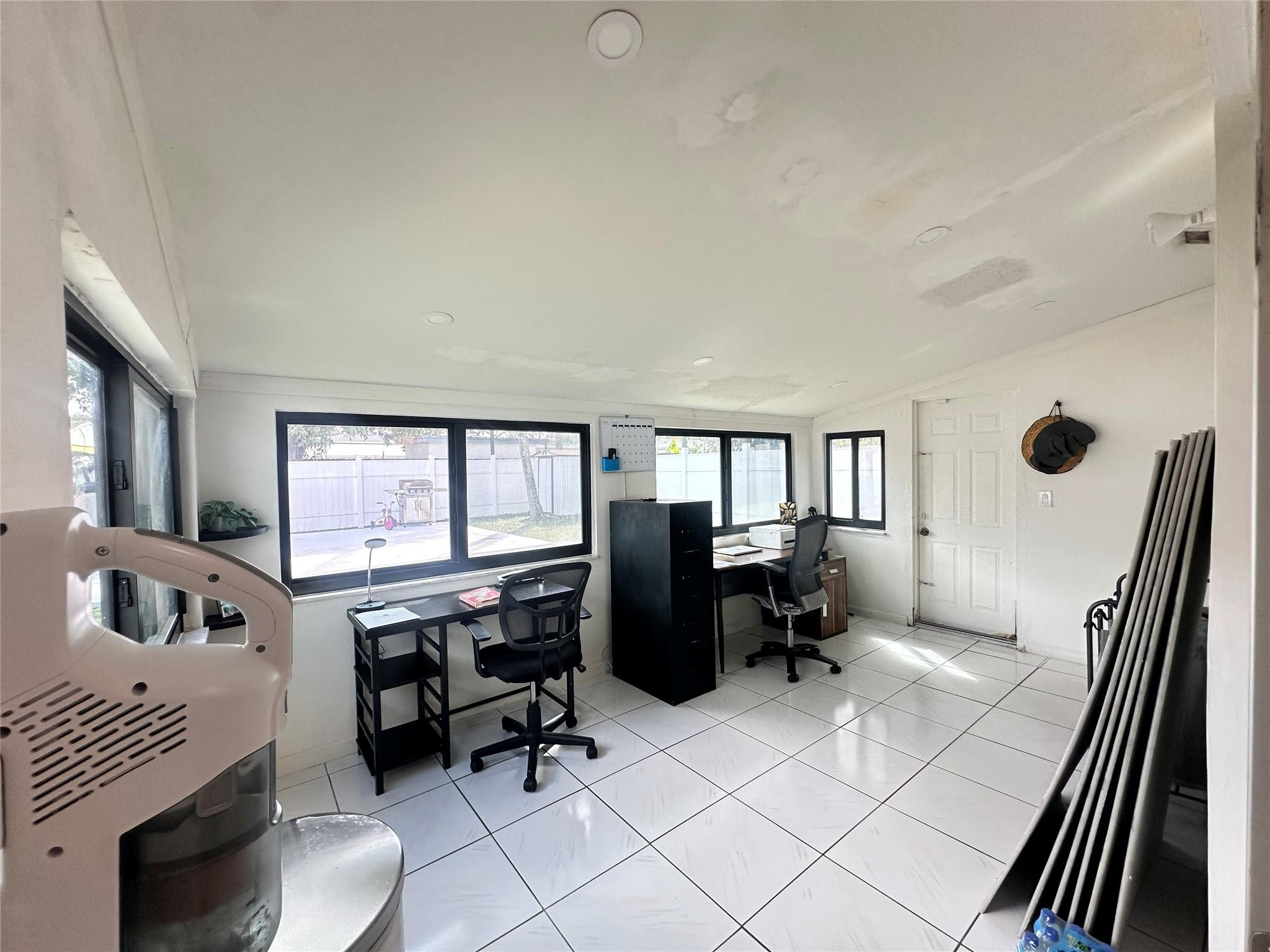 6460 Southwest 30th Street Miramar, FL 33023 - Photo 6 of 8 a workspace with furniture and a window