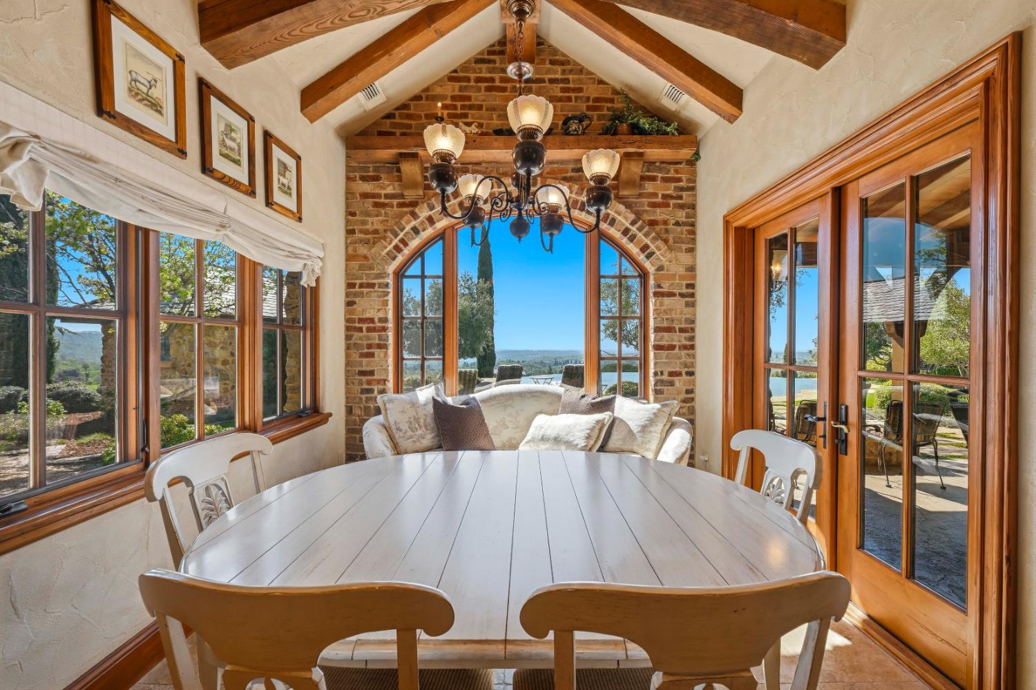 2581 Shirland Tract Road Auburn, CA 95603 - Photo 16 of 61 a view of a dining room with furniture large windows and wooden floor