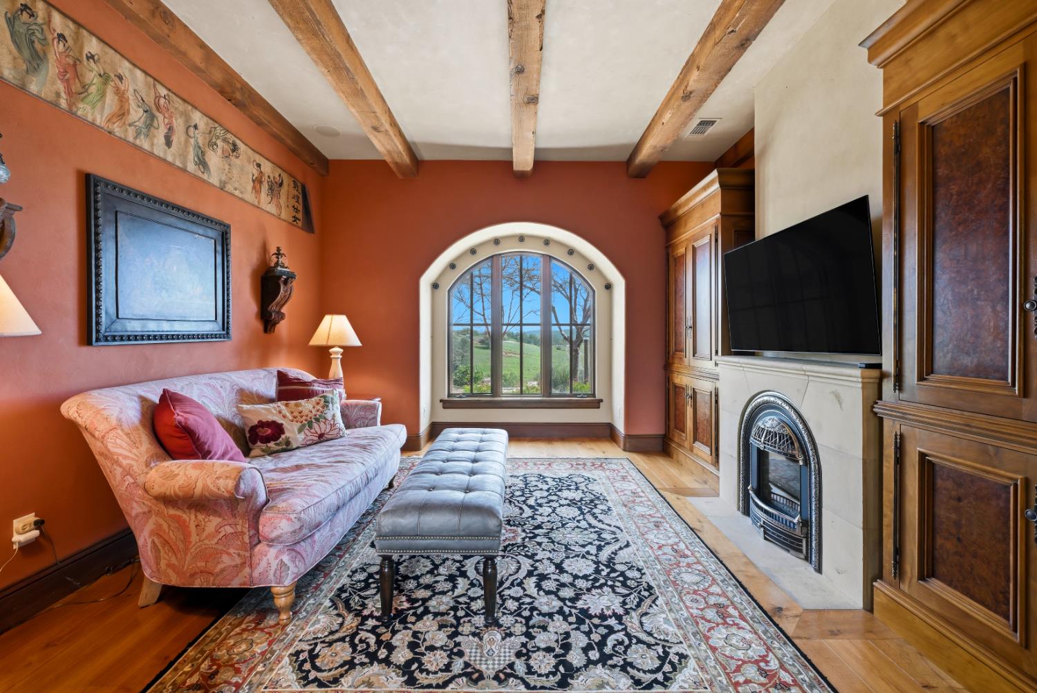 2581 Shirland Tract Road Auburn, CA 95603 - Photo 20 of 61 a living room with furniture a flat screen tv and a fireplace