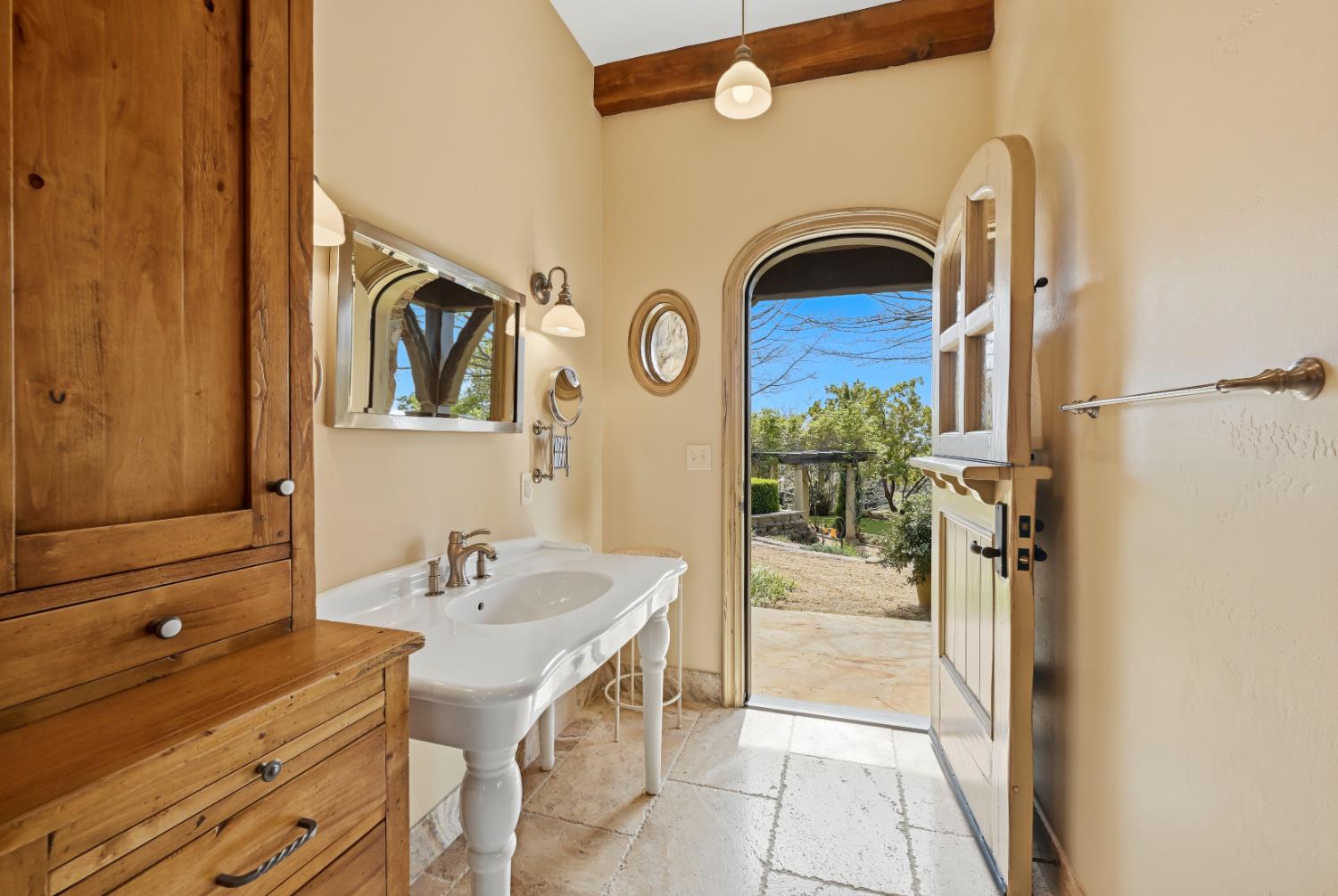 2581 Shirland Tract Road Auburn, CA 95603 - Photo 37 of 61 a bathroom with a sink and a mirror