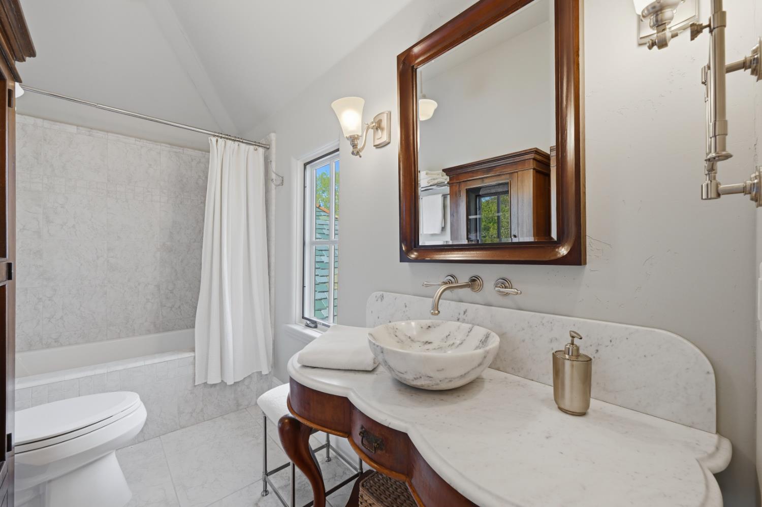 2581 Shirland Tract Road Auburn, CA 95603 - Photo 44 of 61 a bathroom with a sink and mirror with toilet