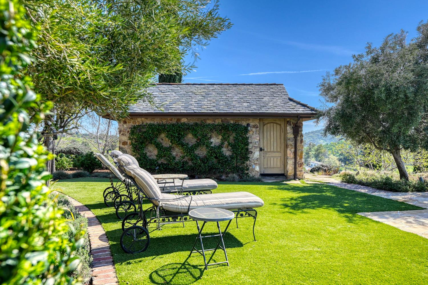 2581 Shirland Tract Road Auburn, CA 95603 - Photo 51 of 61 a view of a chair and table in backyard of the house