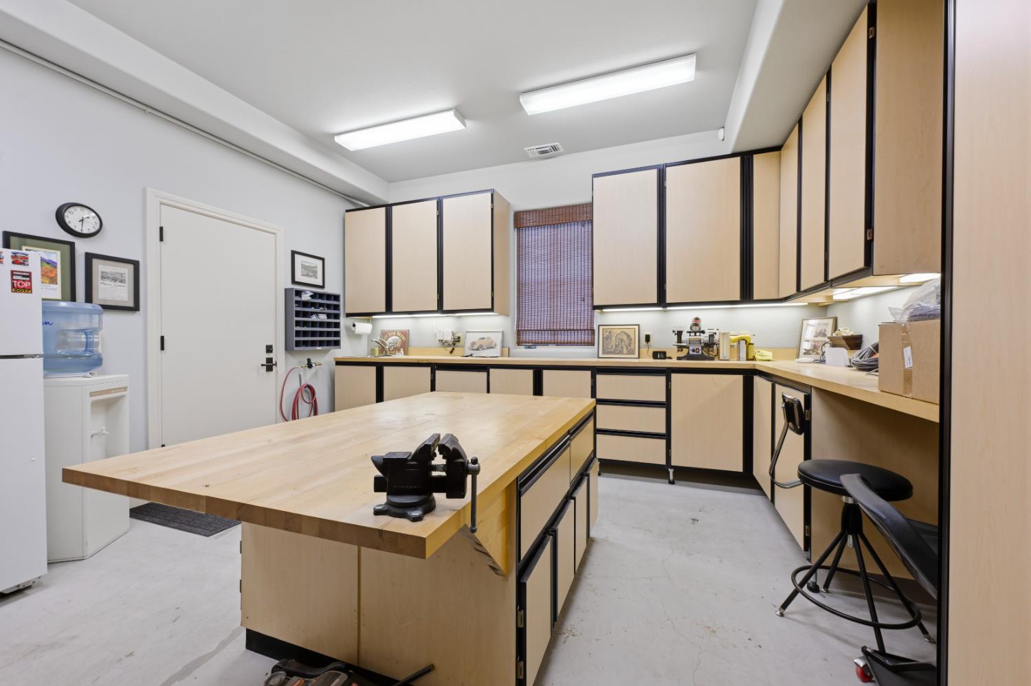 2581 Shirland Tract Road Auburn, CA 95603 - Photo 53 of 61 a kitchen with kitchen island a stove a sink a refrigerator and cabinets