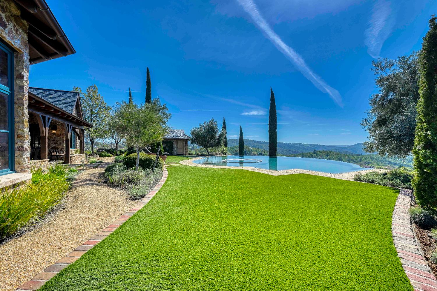 2581 Shirland Tract Road Auburn, CA 95603 - Photo 54 of 61 a view of a chair and tables in the patio with a yard