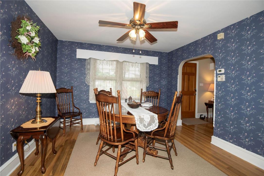 706 Stones Crossing Road Easton, PA 18045 - Photo 14 of 40 A welcoming dining space features beautiful red oak wood flooring and a classic ceiling fan for comfort and style; view of the entranceway,
