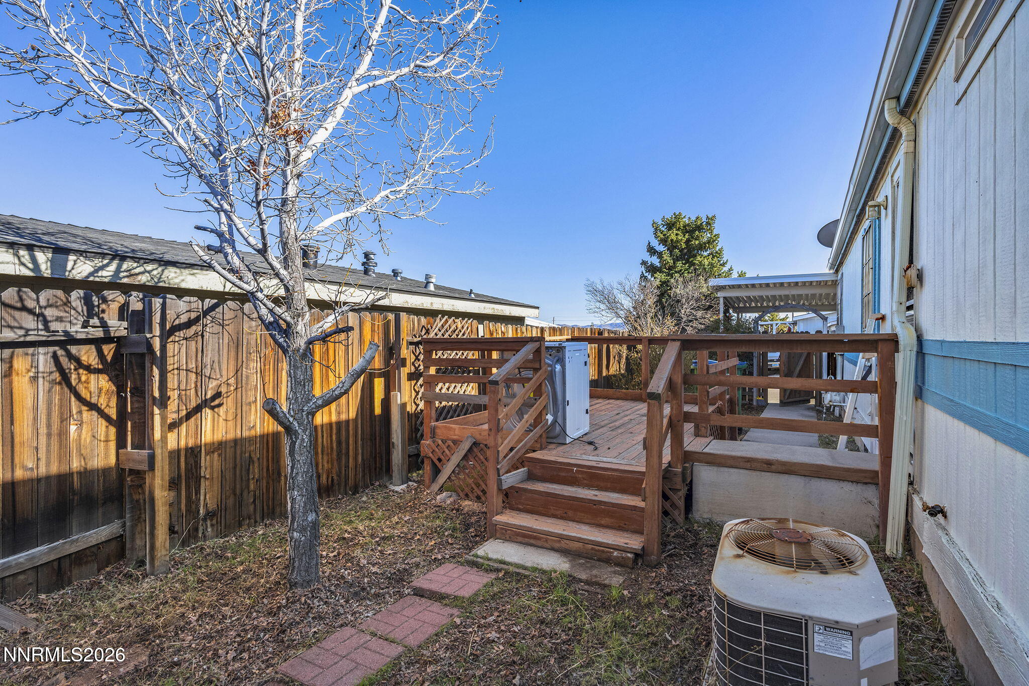 2151 Barberry Way Reno, NV 89512 - Photo 11 of 16 a backyard of a house with barbeque oven and outdoor seating