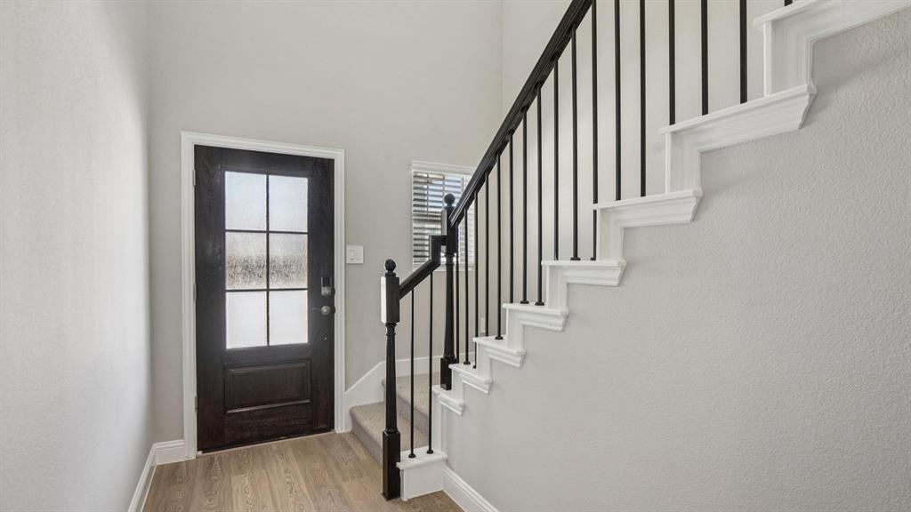 1728 Arches Road Anna, TX 75409 - Photo 5 of 11 Foyer with stairs and light wood-style floors