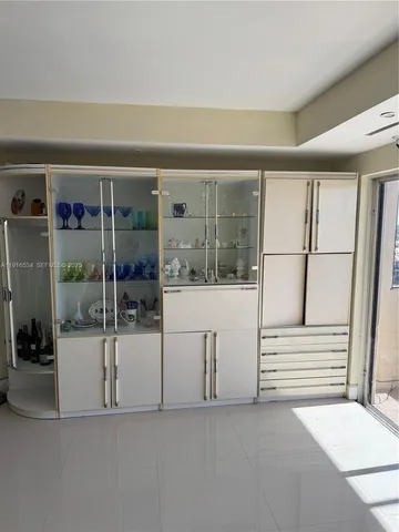 a view of living room with furniture and white walls
