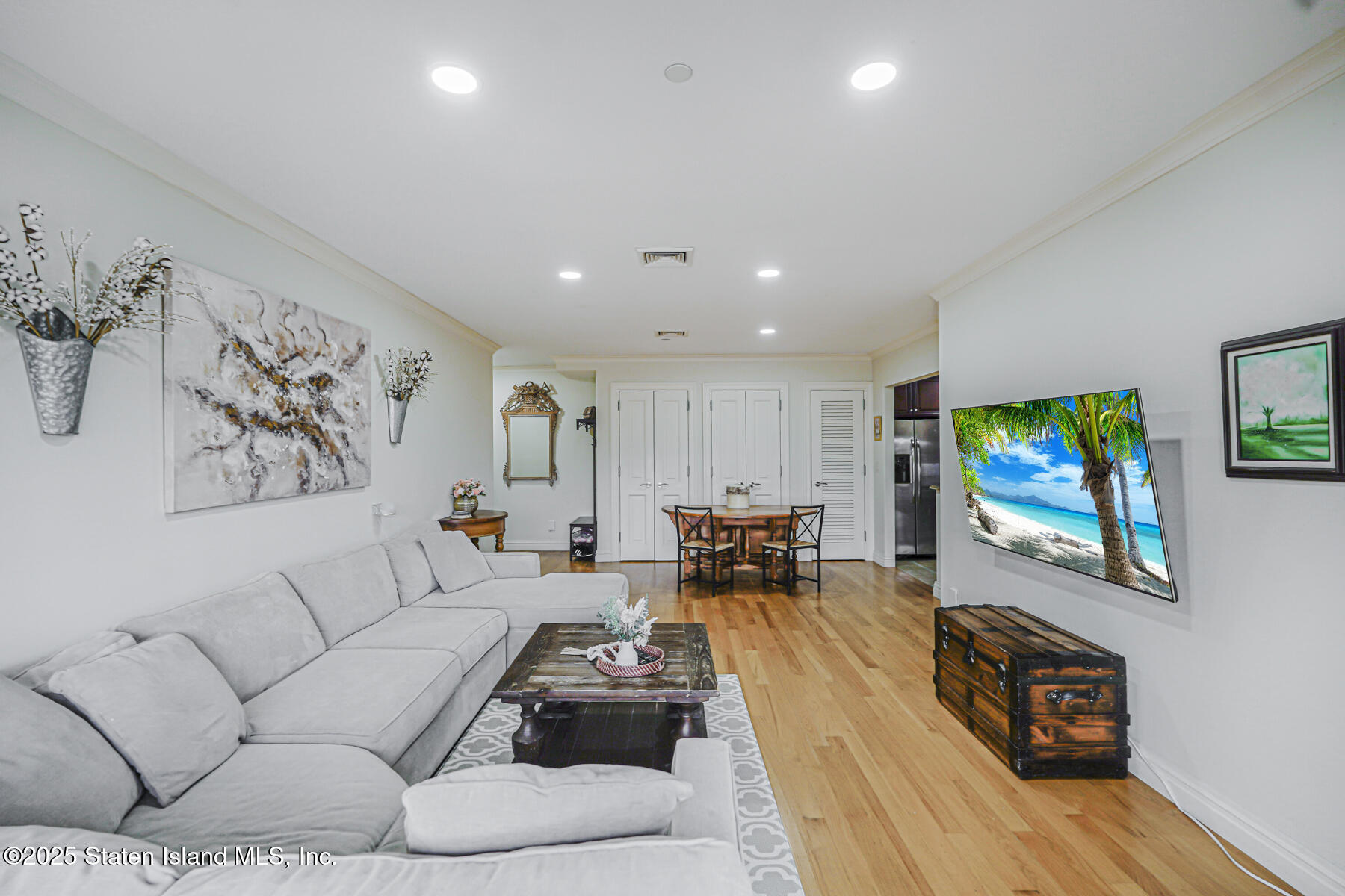 155 Bay Street, Unit 2L Staten Island, NY 10301 - Photo 11 of 32 a living room with furniture and a flat screen tv