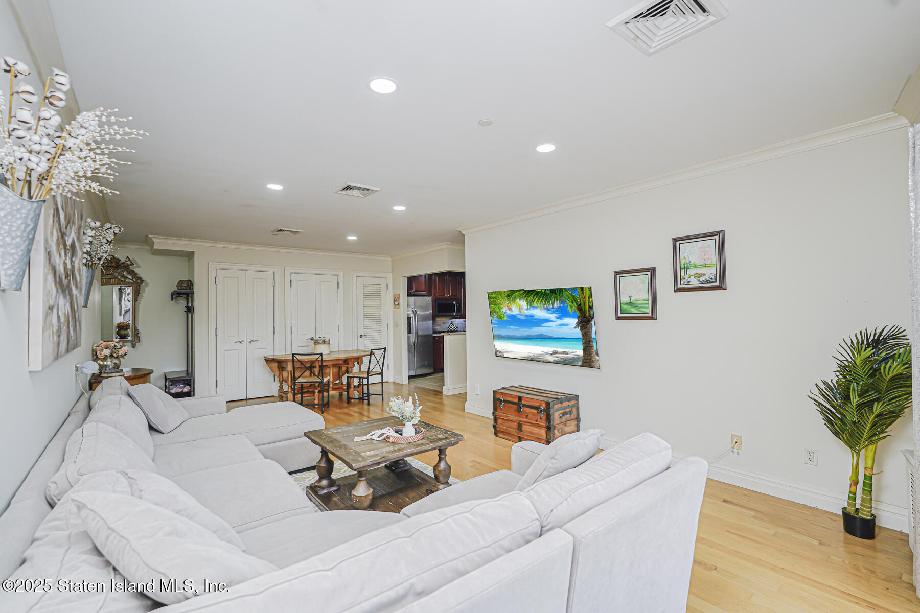 155 Bay Street, Unit 2L Staten Island, NY 10301 - Photo 12 of 32 a living room with furniture and a flat screen tv