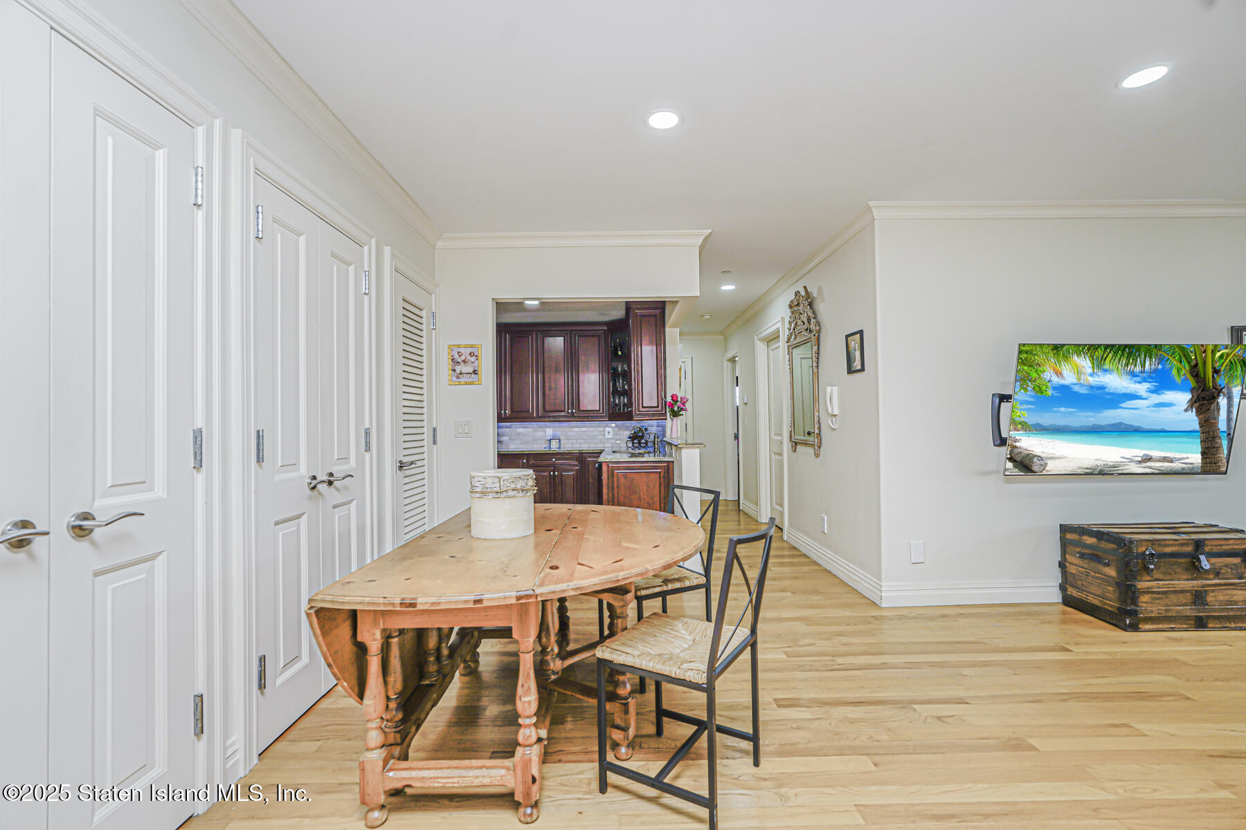 155 Bay Street, Unit 2L Staten Island, NY 10301 - Photo 14 of 32 a dining room with furniture and wooden floor