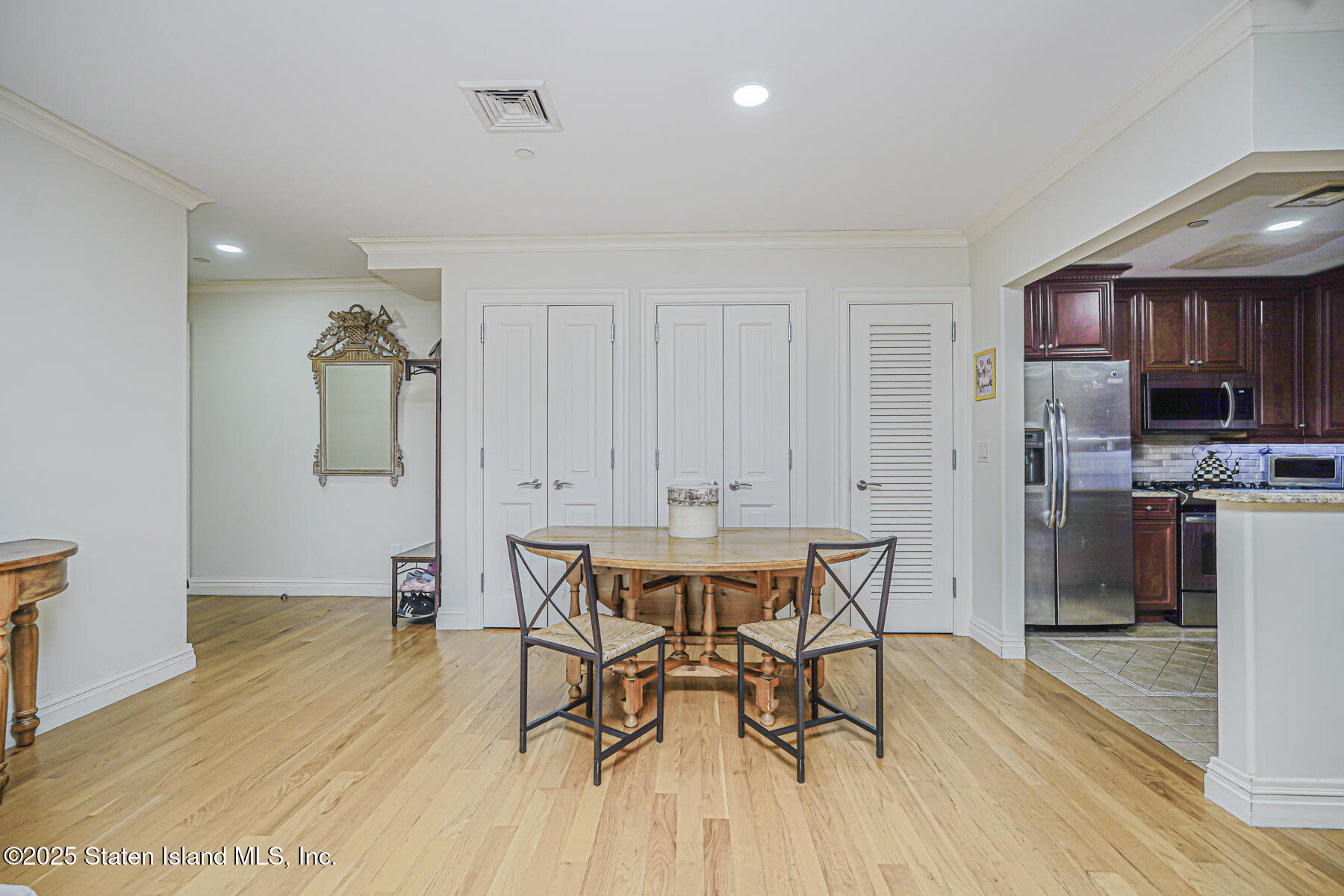 155 Bay Street, Unit 2L Staten Island, NY 10301 - Photo 15 of 32 a view of a dining room with furniture and wooden floor