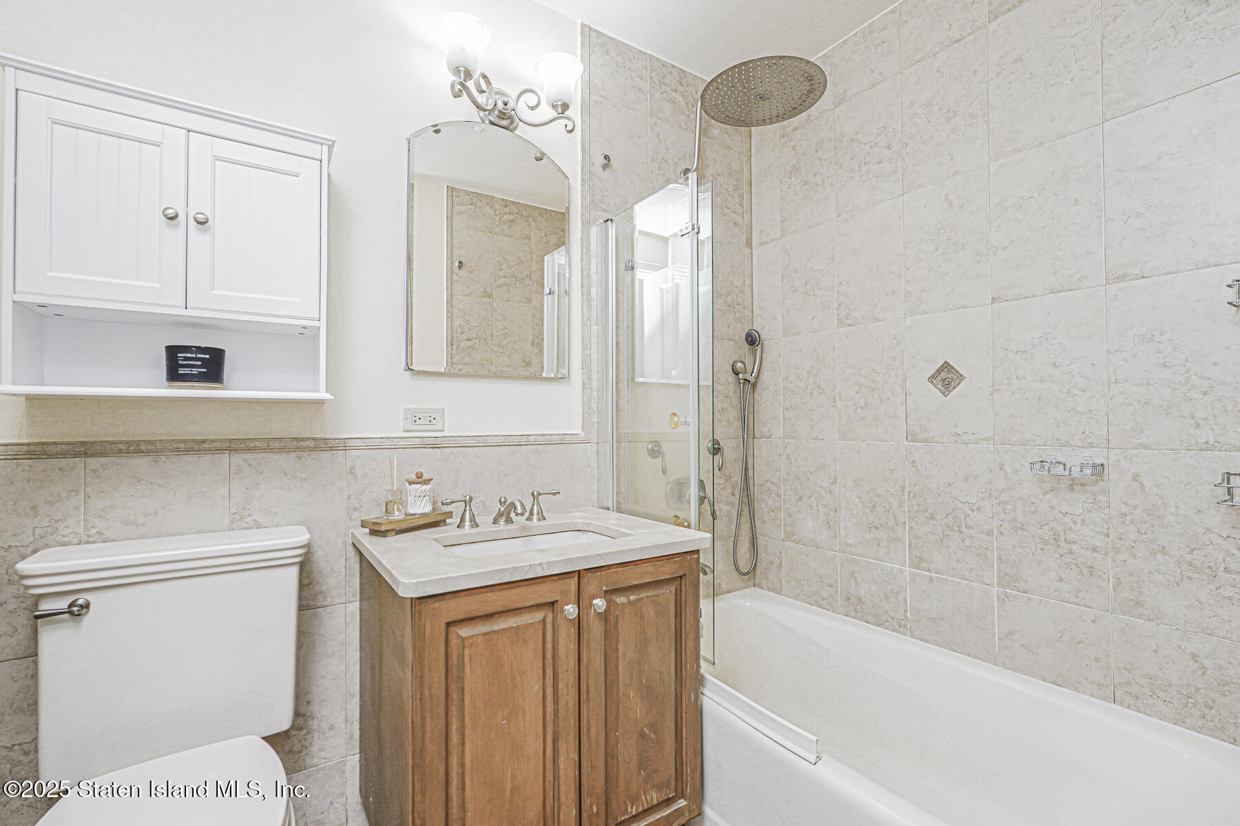 155 Bay Street, Unit 2L Staten Island, NY 10301 - Photo 21 of 32 a bathroom with a sink a toilet and shower