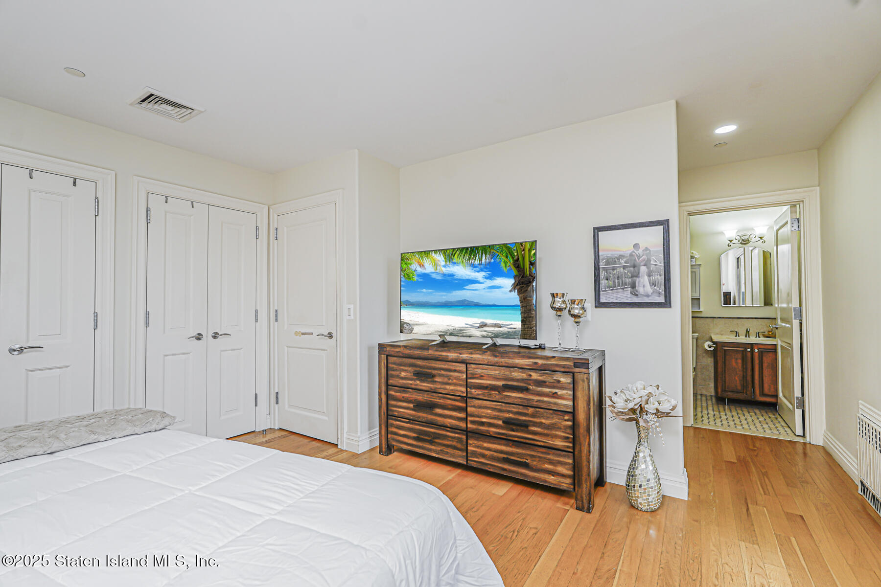 155 Bay Street, Unit 2L Staten Island, NY 10301 - Photo 25 of 32 a bedroom with a bed and furniture