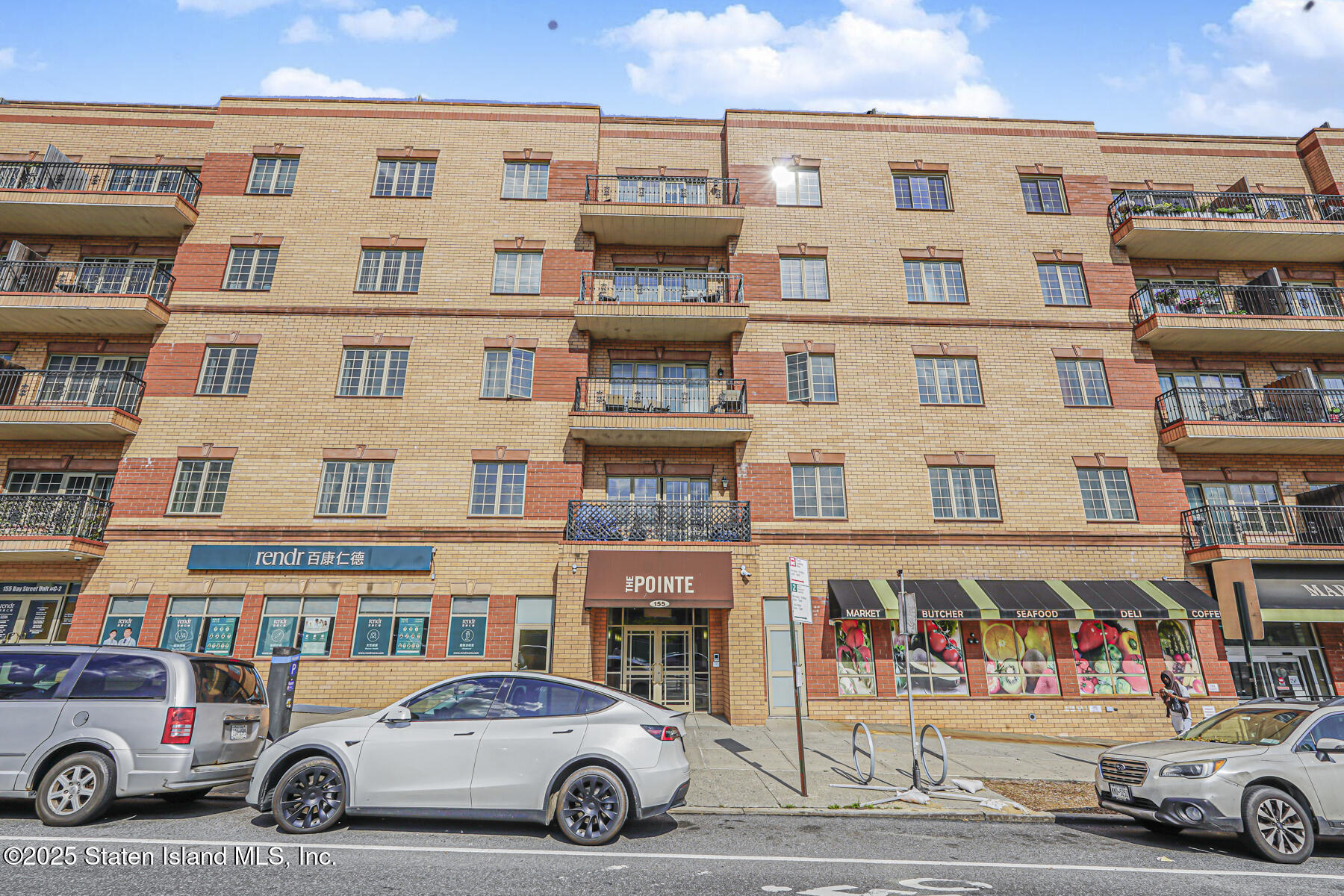 155 Bay Street, Unit 2L Staten Island, NY 10301 - Photo 32 of 32 a car parked in front of a building