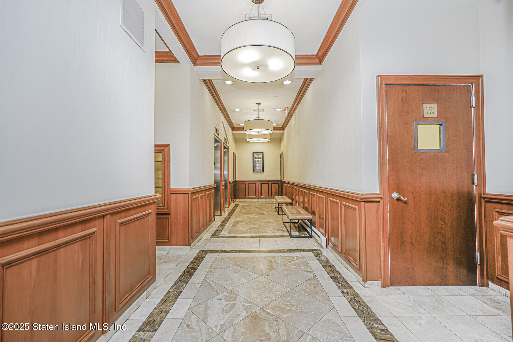 155 Bay Street, Unit 2L Staten Island, NY 10301 - Photo 5 of 32 a view of a hallway with wooden floor and staircase