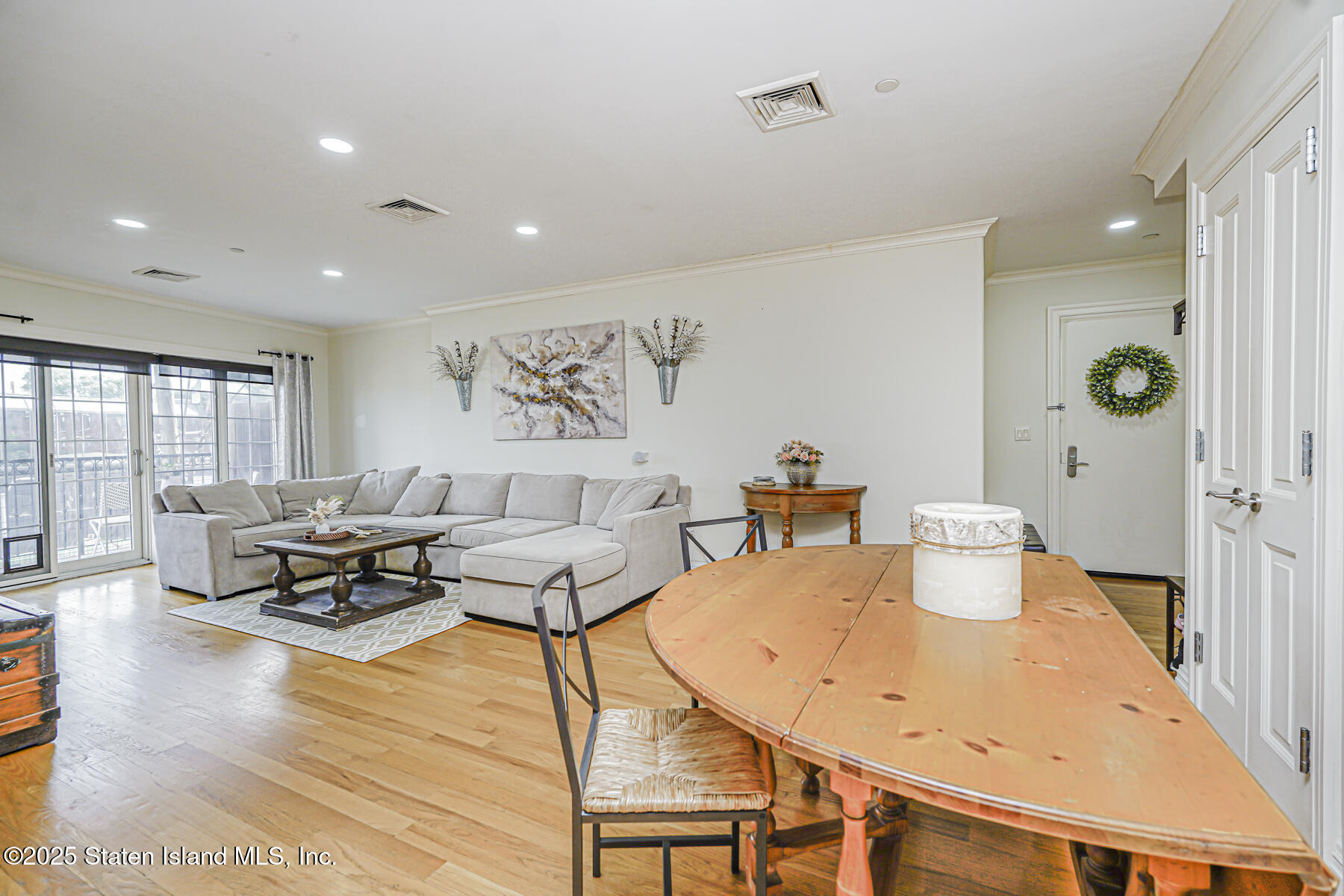 155 Bay Street, Unit 2L Staten Island, NY 10301 - Photo 9 of 32 a living room with furniture and wooden floor