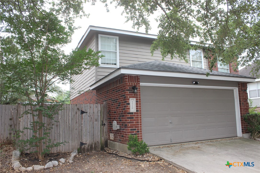7710 Fallen Pine Converse, TX 78109 - Photo 3 of 19 a front view of house with a garden