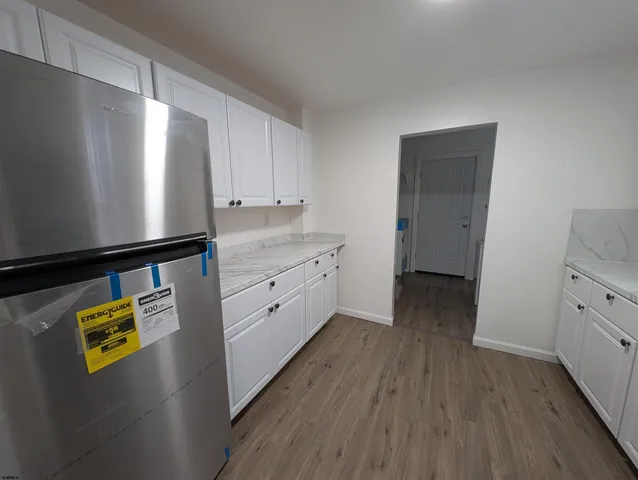 a view of kitchen with wooden floor