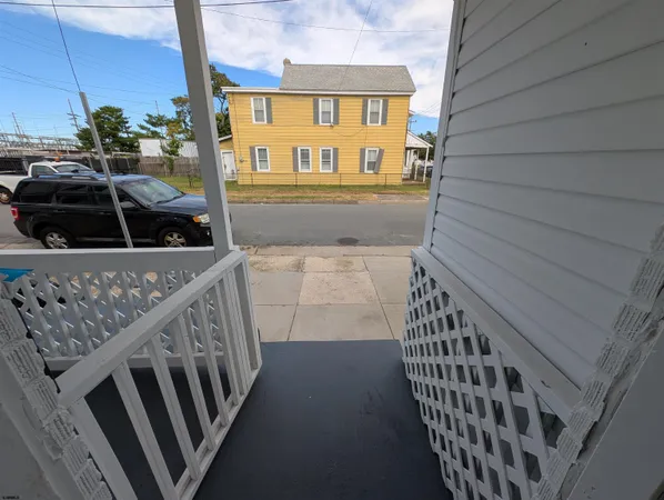 a view of a porch with wooden floor