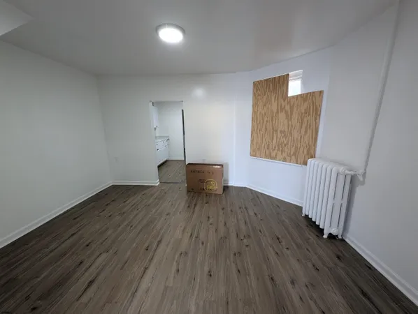 a view of a livingroom with wooden floor