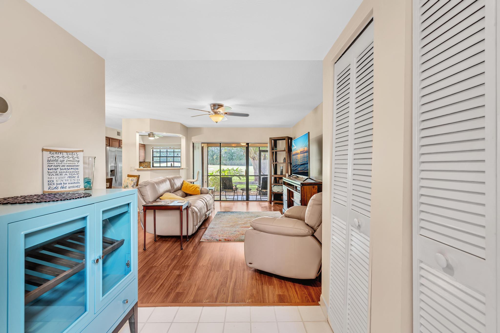 17372 Boca Club Boulevard, Unit 405 Boca Raton, FL 33487 - Photo 11 of 74 a living room with furniture and wooden floor