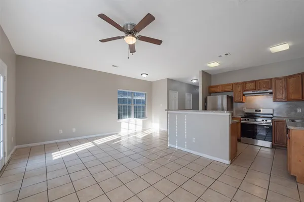 a view of a kitchen with microwave and cabinets
