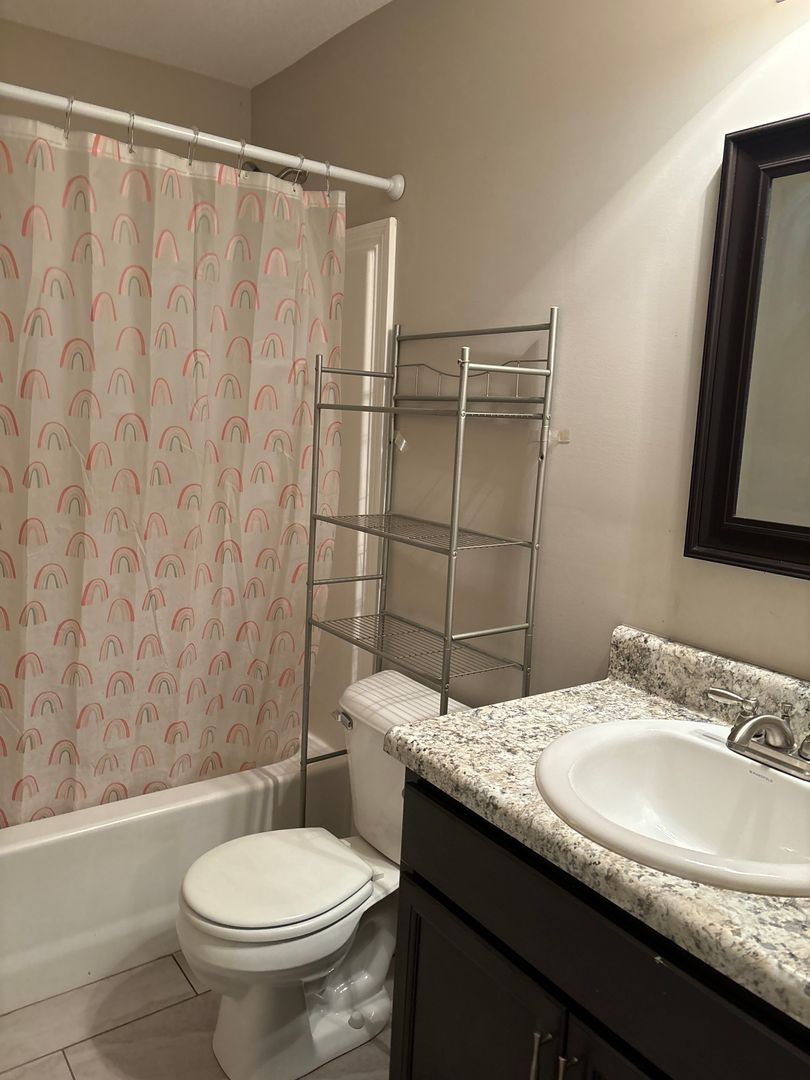 119 Ambridge Street Oak Grove, KY 42262 - Photo 10 of 12 a bathroom with a granite countertop sink toilet and shower