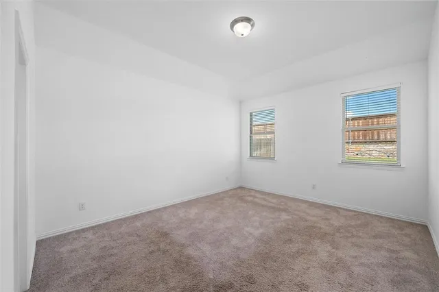 an empty room with closet area