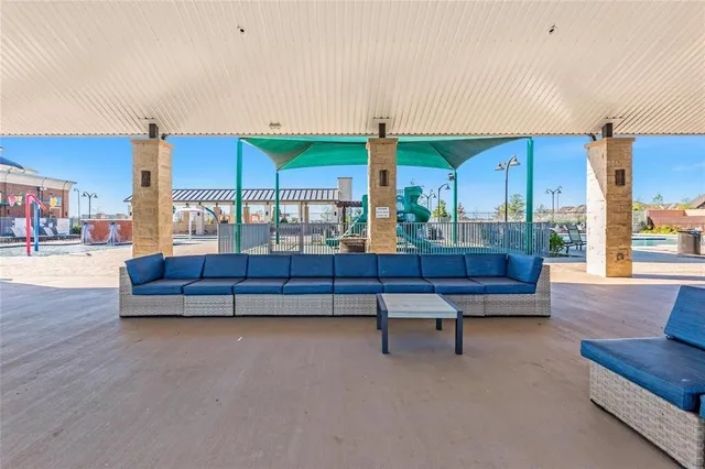 a living room with furniture a table and chairs
