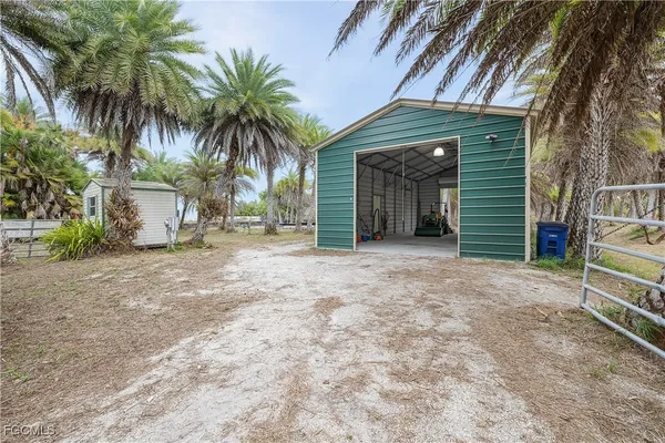 a view of a house with a yard and garage