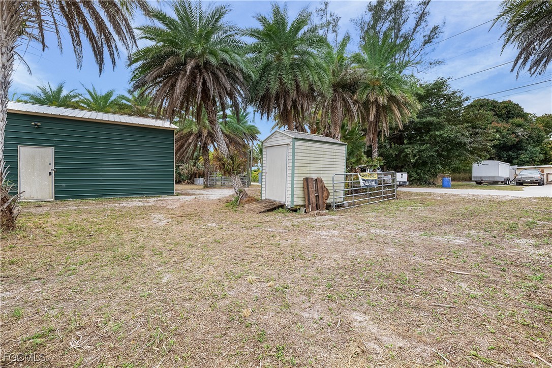 15890 Quail Trail Bokeelia, FL 33922 - Photo 9 of 18 a house with palm tree in front of it