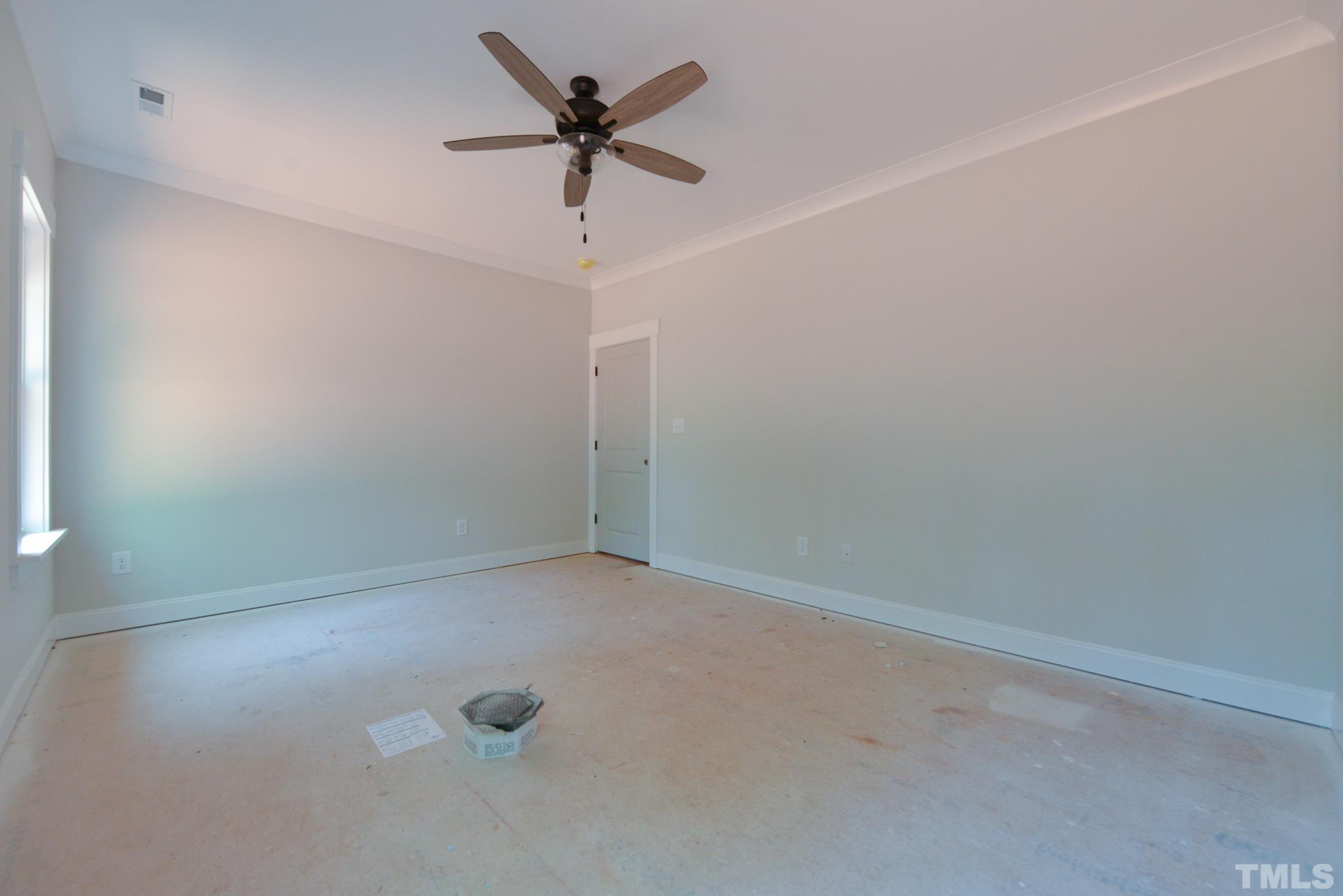 968 Barnes Road Middlesex, NC 27557 - Photo 17 of 31 an empty room with a ceiling fan