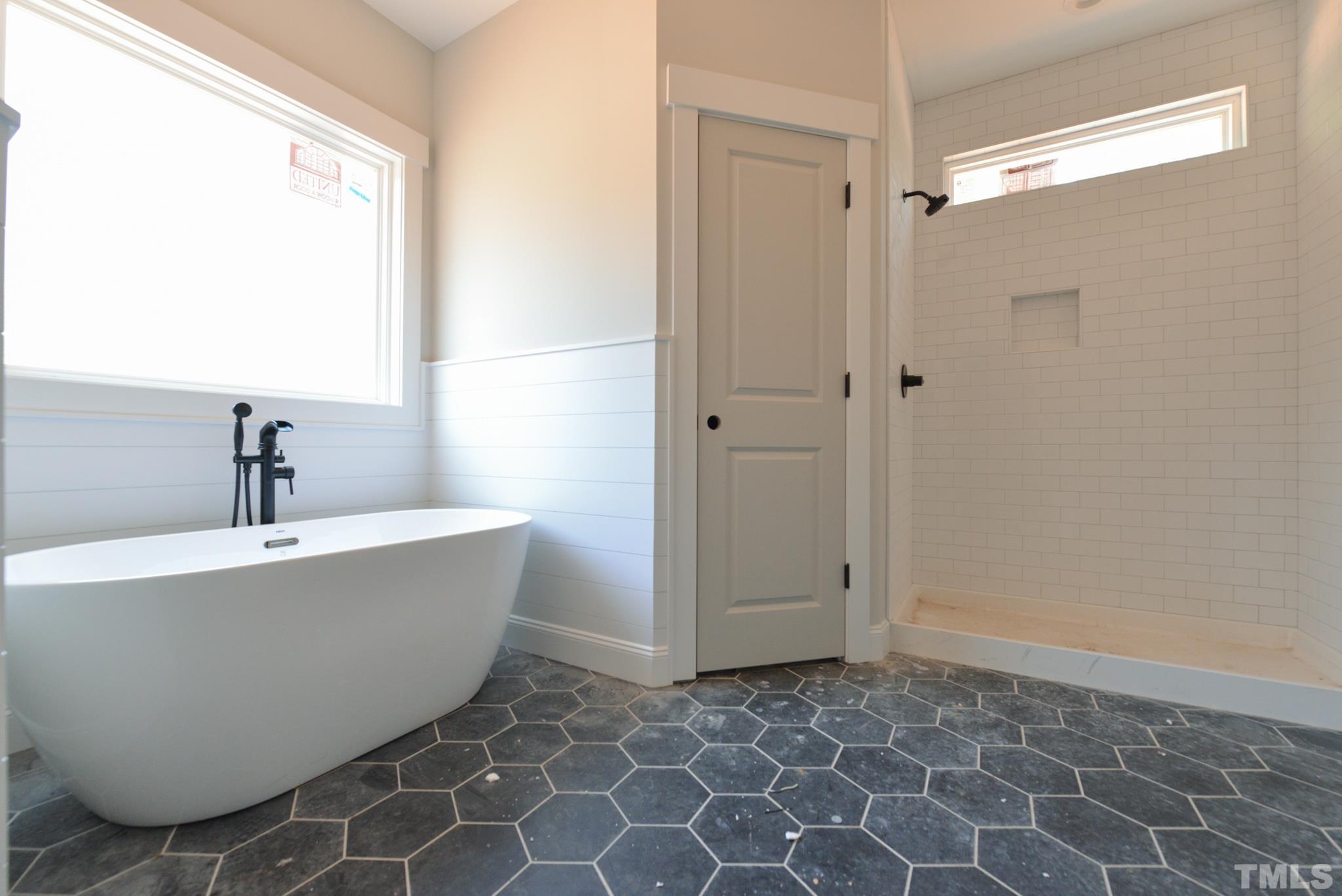 968 Barnes Road Middlesex, NC 27557 - Photo 20 of 31 a bathroom with a bathtub and shower