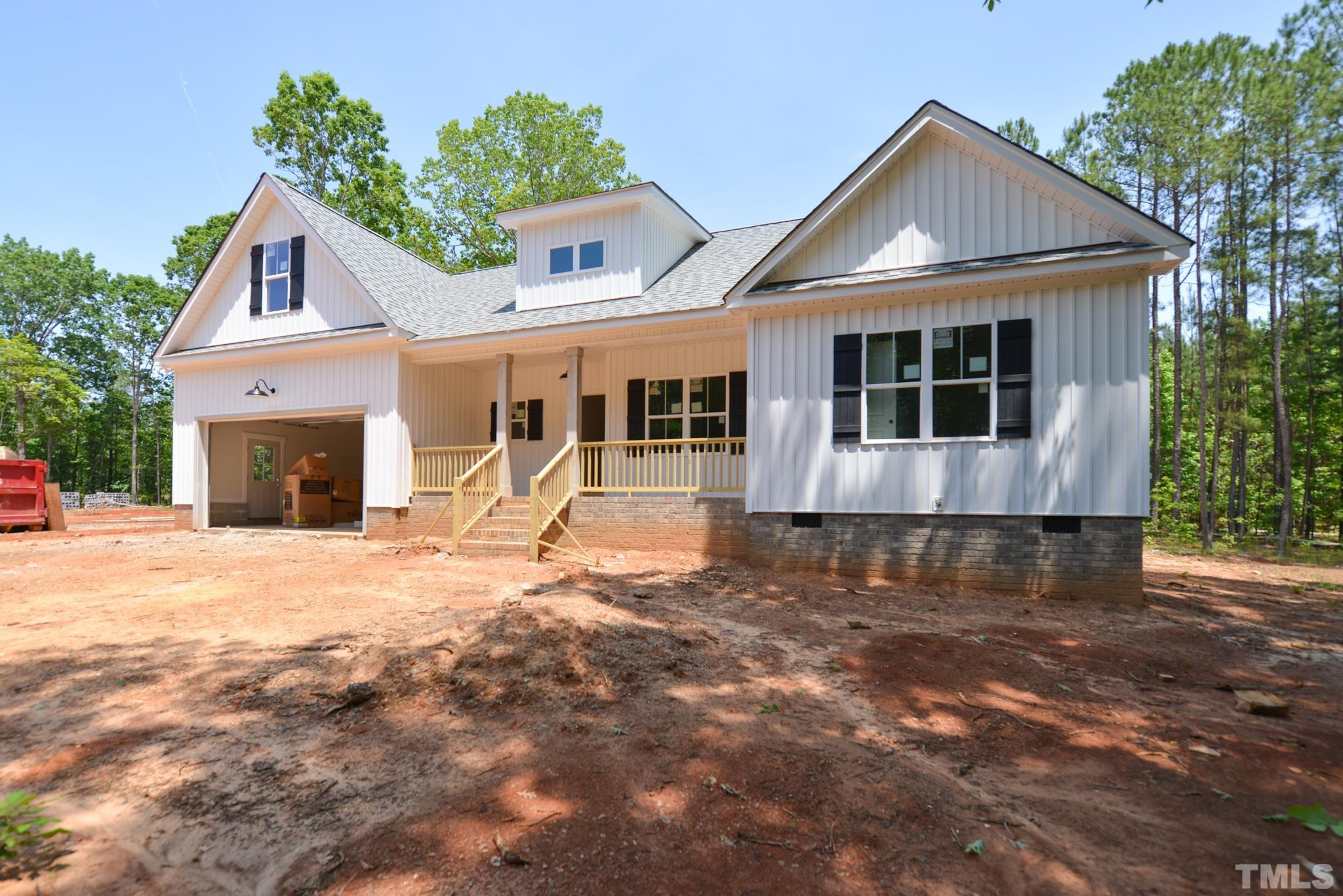 968 Barnes Road Middlesex, NC 27557 - Photo 3 of 31 a front view of a house with a yard and potted plants
