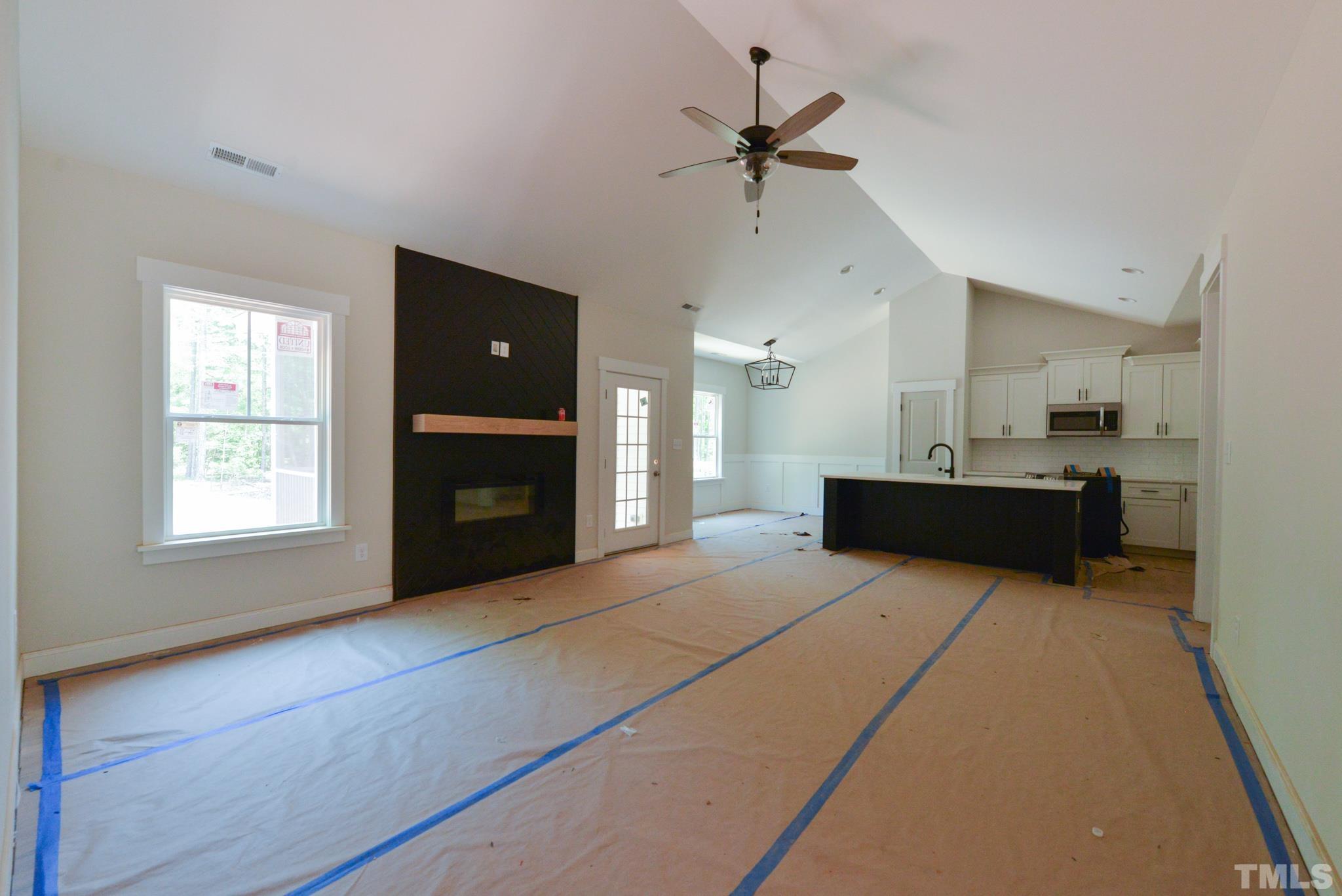 968 Barnes Road Middlesex, NC 27557 - Photo 4 of 31 a living room with stainless steel appliances kitchen island furniture and a window