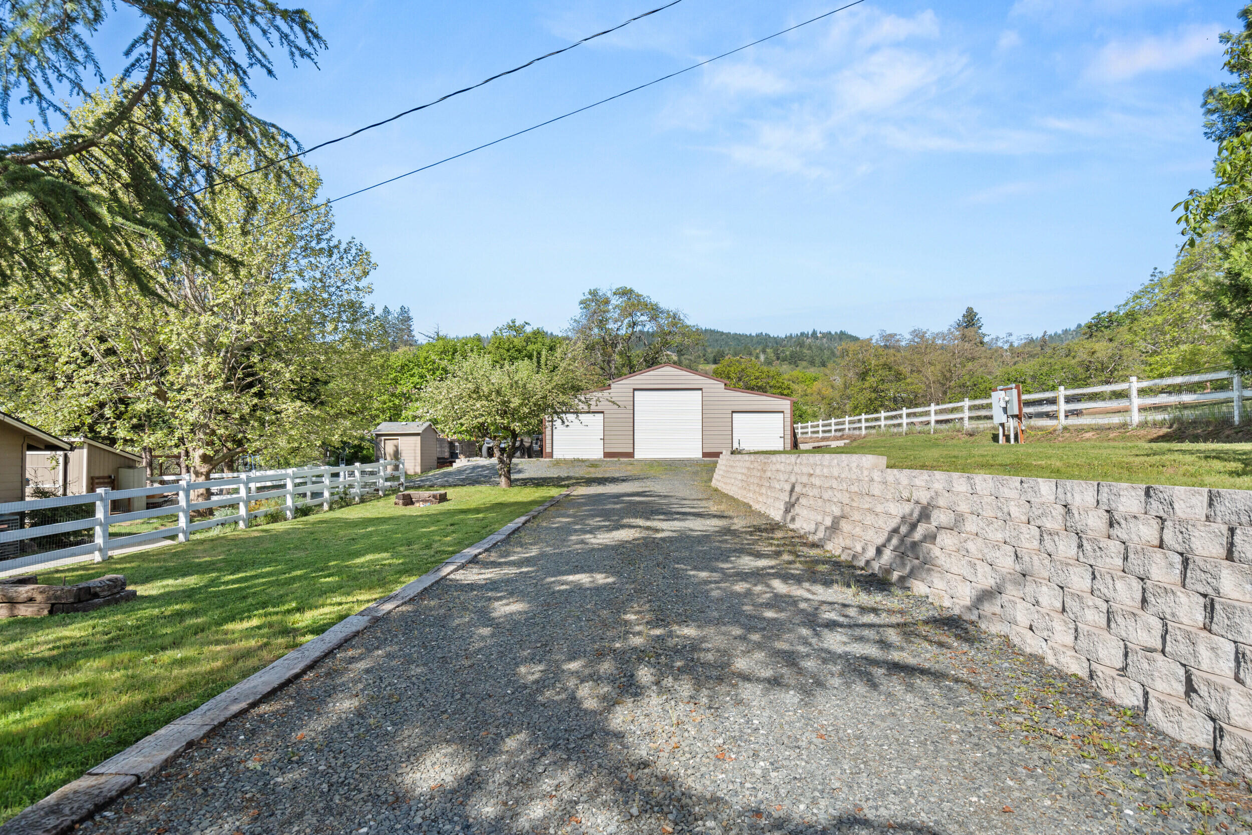 3583 Ross Lane Central Point, OR 97502 - Photo 32 of 52 a view of a big yard next to a lake