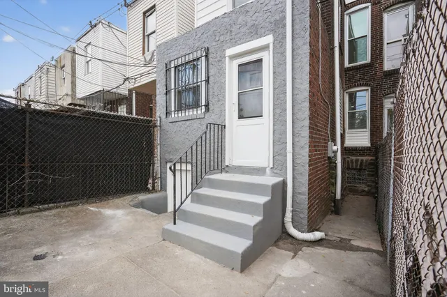 a view of a house with a door and a door
